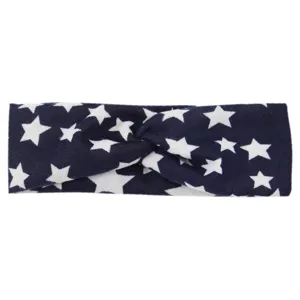 Close-up detail of the dark blue fabric twist headband featuring a stylish white star pattern design.