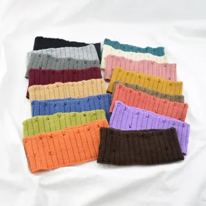Close-up detail of knitted distressed hair band, cozy wool material, multi-color variety available.