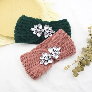 Knitted rhinestone headband detail showing sparkling crystal embellishment and texture.