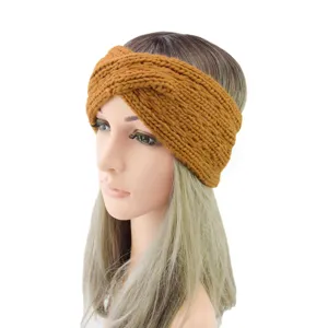 Chunky knit headband in mustard yellow, featuring a stylish twisted cross design for cozy warmth.
