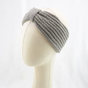 Close-up detail of grey knitted headband with rib knit texture and stylish twist bow.