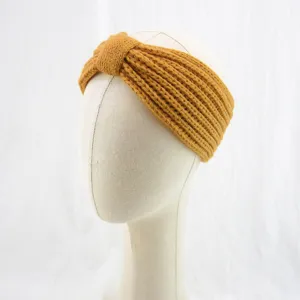 Detailed view of cozy knit headband, warm ribbed winter hair accessory close up display