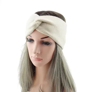 Knitted headband detail view, soft cozy warm winter ear warmer cross twist hair accessory beige