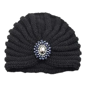 Black knitted turban hat with crystal rhinestone brooch, stylish bohemian headwear.
