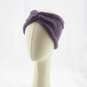 Detailed closeup of purple knitted twisted headband, cozy wool texture for winter warmth.