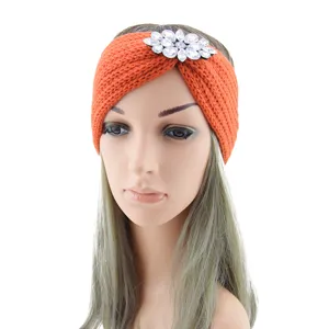 Orange knitted rhinestone headband for women, crystal flower winter ear warmer hair accessory.