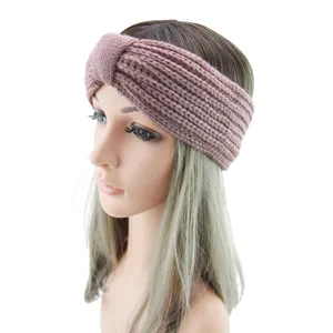 Knitted headband detail, ribbed texture and twist bow design, warm winter hair accessory.