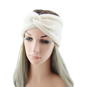 Chunky knit twist headband in off-white, perfect for keeping warm during autumn and winter sports.