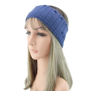 Blue knitted headband with distressed holes, stylish hair accessory for sports and yoga use.