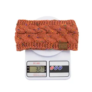 Knitted headband with colorful speckles, cozy cable knit winter hair accessory and C logo.