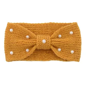 Detailed view of the knitted wool headband featuring elegant pearls and a chic bow knot design.
