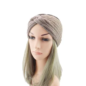 Knitted twist headband with metallic gold thread for women, stylish elastic hair accessory.