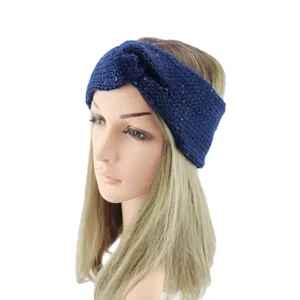 Detail view of the dark blue knitted sequin twist headband, cozy winter hair accessory.