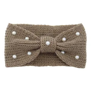 Detailed close-up of brown knitted headband featuring elegant white faux pearl embellishments.