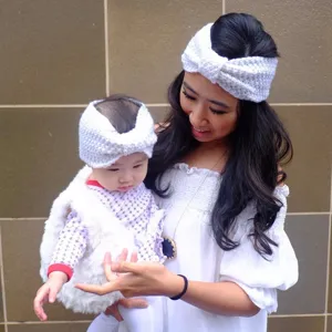 Handmade white knit headband for mother and baby, cozy bow hair accessory for daily warm wear.