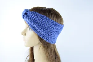 Detailed side view of the blue knitted headband, cozy winter ear warmer and hair accessory.