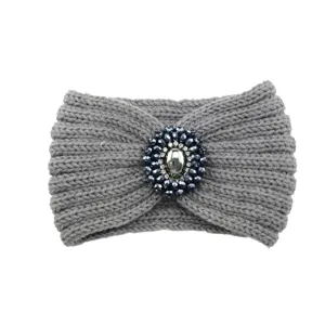 Grey knitted hairband detail, crystal beaded decoration, winter cozy headband design.