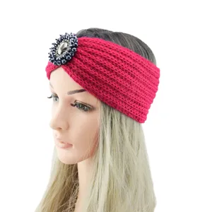 Detailed closeup of handmade knitted rhinestone crystal headband on mannequin for winter style