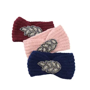 Detailed view of handmade crystal beaded leaf knitted headband, winter warm ear warmer.