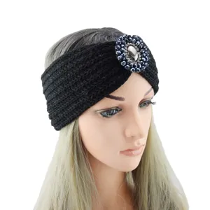 Black knitted headband with rhinestone crystal gemstone flower, warm winter hair accessory for women.