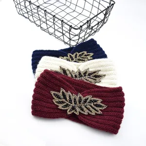 Knotted winter headband set with elegant beaded leaf embellishments, warm knit hair accessories.
