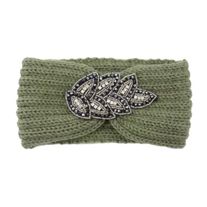 Detailed view of the green knitted wool headband featuring exquisite beaded leaf design.