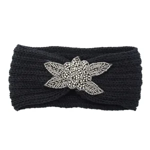 Black knitted headband featuring a sparkling beaded floral detail for warmth and style.