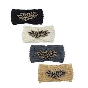 Close-up of handmade beaded leaf knit headbands in four chic colors for cozy autumn daily styling.