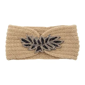 Chic beige knitted headband featuring an exquisite black beaded leaf embellishment for winter style.