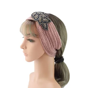 Rhinestone knitted headband for women, stylish crystal leaf winter warm hair accessory detail.