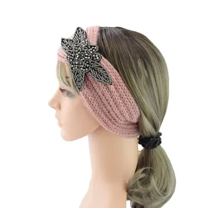 Pink knit headband with beaded flower applique for women winter warmth and stylish daily wear.