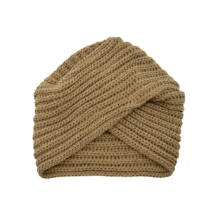Brown knitted crisscross turban hat detail shot, textured woolen winter warm beanie cap