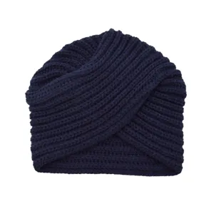 Navy blue knitted turban detail, cozy cashmere-feel cross beanie knitwear close-up view.