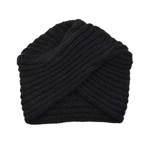 Detailed view of black knitted turban hat, cozy cross design woolen winter beanie for women.