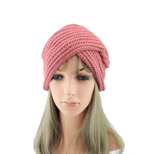 Pink knit turban hat detail, soft cashmere feel cross design winter head wrap accessory.