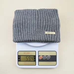 Detail shot of grey ribbed knit headband, showing soft double-layer wool texture and weight.