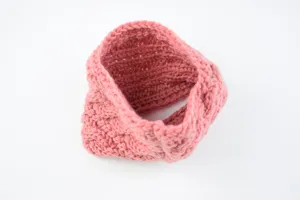 Pink knitted braided headband winter ear warmer detail view, soft cozy hair accessory
