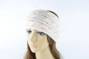 Close-up detail of the beige chunky knit headband featuring a textured twist pattern for warm wear.