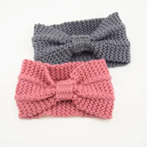 Close-up detail of cozy knit wool headbands featuring soft texture and warm braided design.