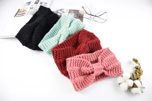 Detailed view of knitted winter headbands in four colors, featuring cozy twist design and texture.