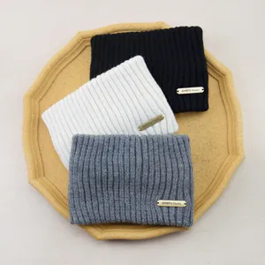 Detail view of knitted headband, double layer solid color warm winter hair band accessory.