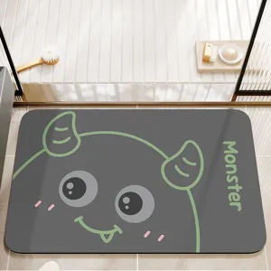 Absorbent cartoon bathroom floor mat, non-slip diatomaceous earth mat with cute monster design.