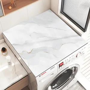Gedetailleerd overzicht van wasmachine bovenafdekkingsmat in marmeroptiek, absorberend en antislip.