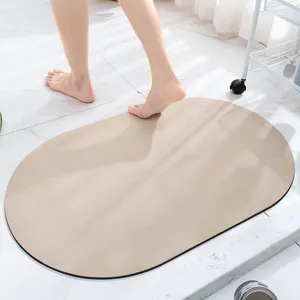 Oval absorbent bath mat, quick drying non-slip floor mat for bathroom and home entrance use.