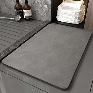 Close-up of grey diatomaceous earth bath mat detail, modern minimalist bathroom decor and texture.