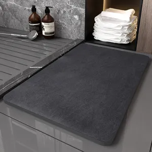 Dark grey diatomaceous earth bath mat, minimalist non-slip floor mat for modern bathroom use.