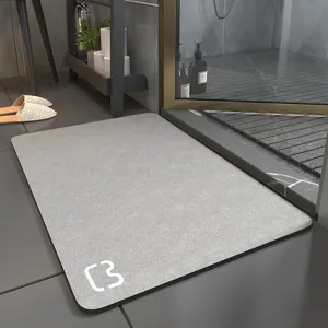 Detail shot of grey diatomaceous earth bath mat, non-slip design for bathroom floor.