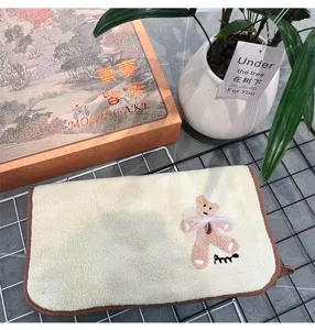 Cute teddy bear embroidered towel detail, soft absorbent fabric with brown edge trim.