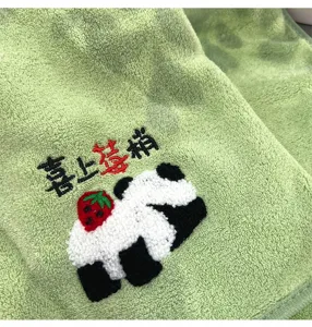 Green coral fleece face towel featuring cute cartoon panda and strawberry embroidery detail.