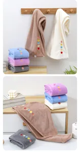 Quick dry coral fleece hair towel wrap for women, soft absorbent shower cap with button design.